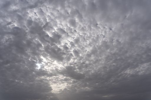 A blue sky with large white clouds on a sunny day, with a copy space - great for backgrounds