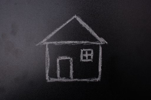 A closeup shot of a house drawing on a blackboard