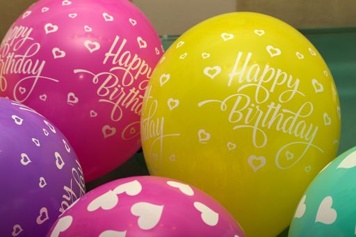 The beautiful colourful balloons with "Happy Birthday" written on it