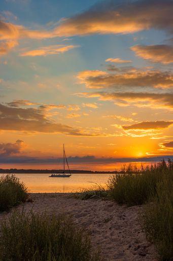 A vertical shot of cloudy sunset sky over Greifswald on the Baltic Sea, Germany