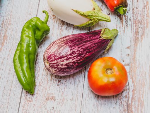 A top view of vegetables on a wooden surface