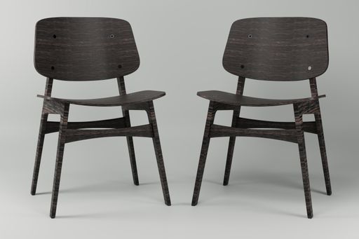 A closeup of wooden chairs in the white studio