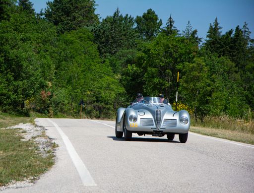 URBINO, ITALY - JUN 16 - 2022 : ALFA ROMEO 6C 2500 SS SPIDER COLLI 1947 on an old racing car in rally Mille Miglia 2022 the famous italian historical