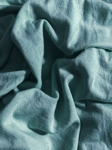 A vertical closeup shot of a blue blanket