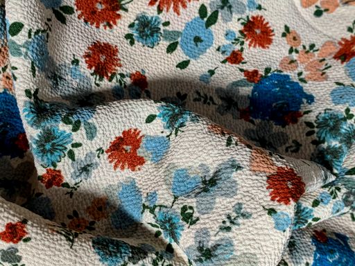 A closeup shot of nice bed sheets with flowers