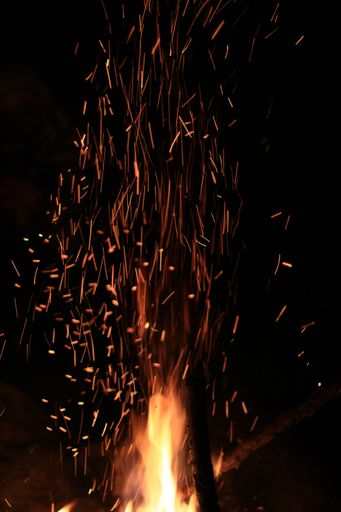 A closeup of fire sparks, fire flame on the black background
