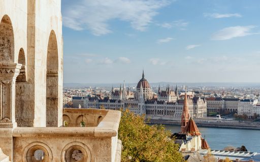 A distant view of the Hungarian Parliament on a sunny day in Budapest