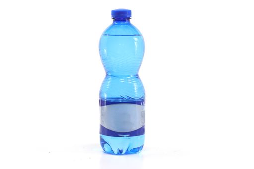 A closeup of a mineral water bottle isolated on a white background