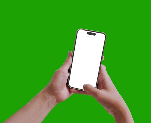 A closeup of female hands holding a smartphone on a chroma key background