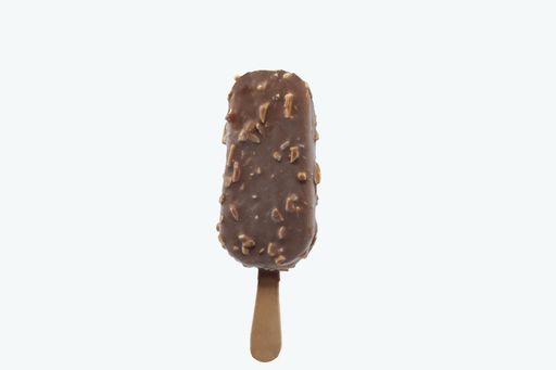 A closeup of ice cream with nut and chocolate topping isolated on a white background
