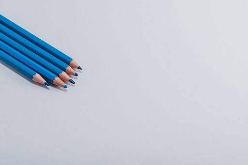 Blue wooden pencils isolated on white background. close up