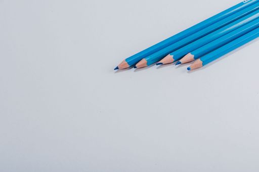 Blue wooden pencils isolated on white background. close up