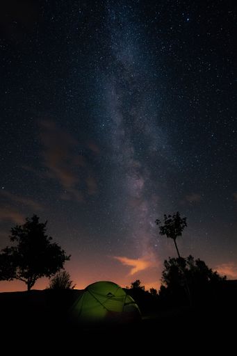 A vertical of a tent with a starry sky.