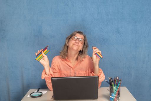 A thoughtful female with laptop computer working from home or office
