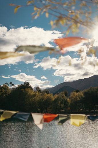 beautiful Buddhist tibetan prayer flags hanging against a view of hills in leh ladakh