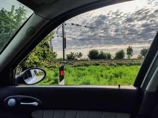 Railway in the countryside seen from the car window scene
