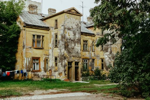 A closeup shot of an old abandoned house