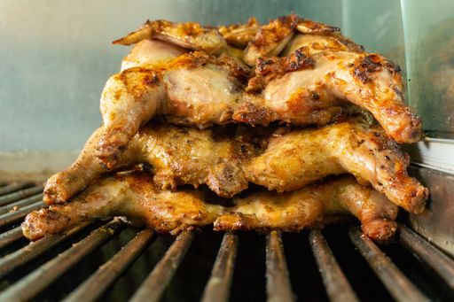 A closeup shot of freshly cooked chicken on a grill