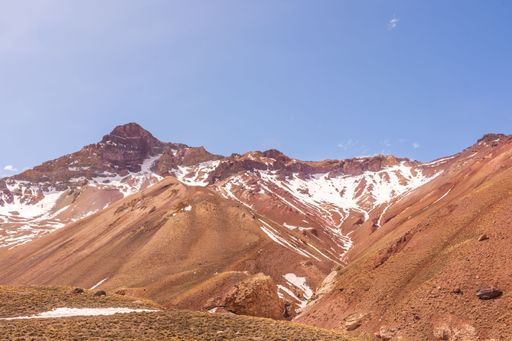 A view of the bald Andes mountain range under the blue sky in  Mendoza