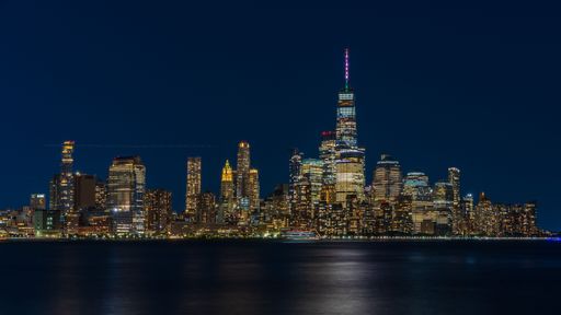 An amazing view of the New York City Manhattan skyline illuminated with lights
