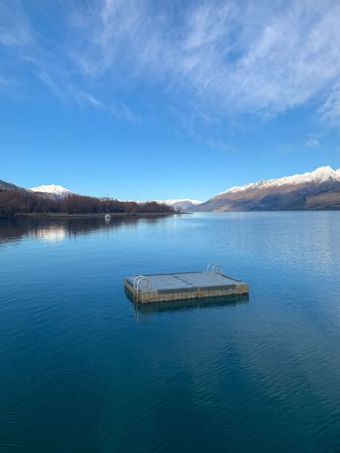 A vertical shot of a beautiful lake near the mountains