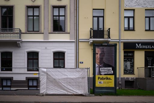 An advertisement billboard on a wall of a residential building in Riga, Latvia