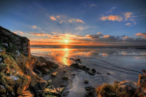 A beautiful scenery of the breathtaking sunrise reflecting in the sea