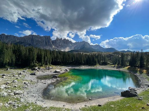 A beautiful view of Lake Carezza and Latemar mountain in the Dolomites, South Tyrol, Italy