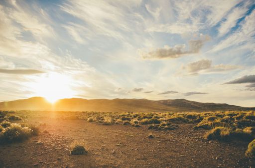 A beautiful shot of a desert landscape with beautiful sky at sunrise
