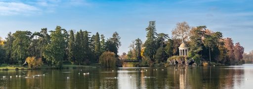 Vincennes, the temple of love and artificial grotto on the Daumesnil lake, in the public park, in autumn