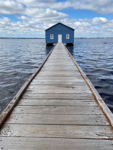A vertical shot of Crawley Blue Boat Shed, Swan River, Perth, Australia