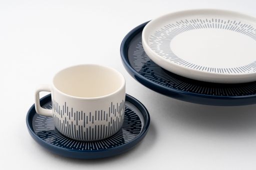 A set of blue and white luxury ceramic kitchen utensils on a white background.