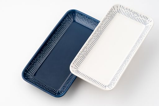 A set of blue and white luxury ceramic kitchen utensils on a white background.