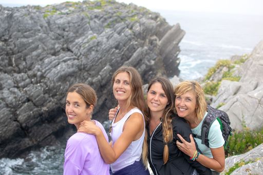 A group of female Caucasian friends on the coast
