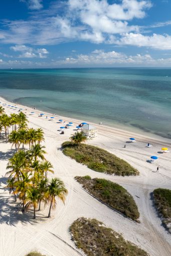An aerial view of Crandon Park Beach in Key Biscayne on a sunny day in Miami, Florida