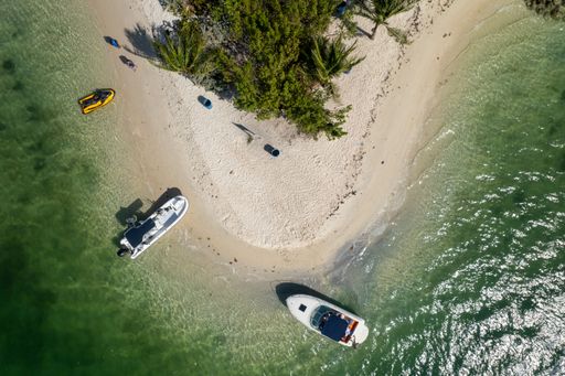 An aerial view of the beautiful coastline in Miami with parked ships