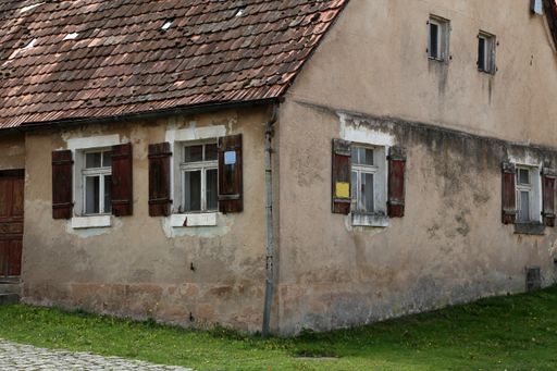 An old abandoned house intended for demolition during daylight