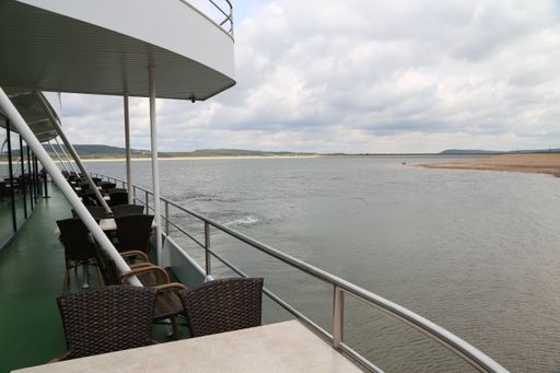 Empty tables and chairs on a boat deck at a tour on a Lake in Bavaria.