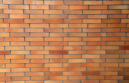 A closeup shot of red brick wall - wallpaper or background