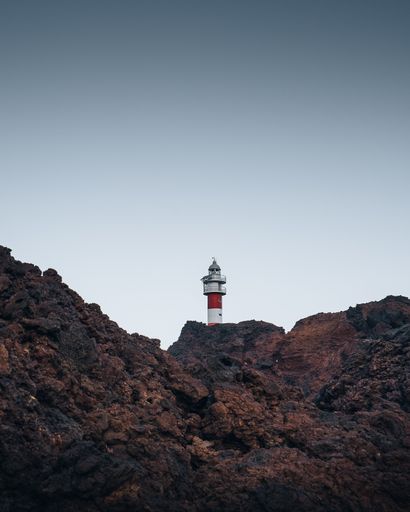 A vertical shot of the Punta de Teno Lighthouse in Canary Island, Spain