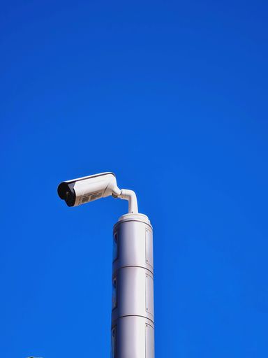 A video surveillance camera on metal rod