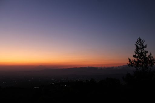 A beautiful shot of the Mount Slamet in Indonesia in a distance during an evening