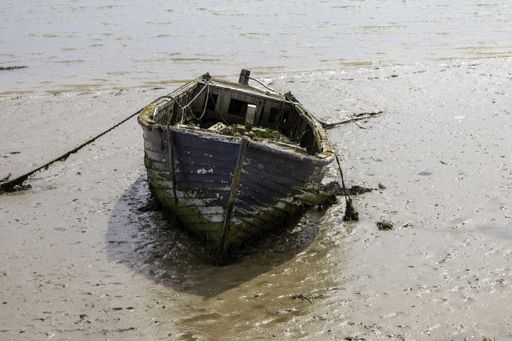 An abandoned boat on the River Ore in Orford, Suffolk.