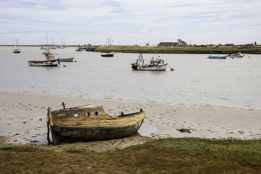 An abandoned boat on the River Ore in Orford, Suffolk.