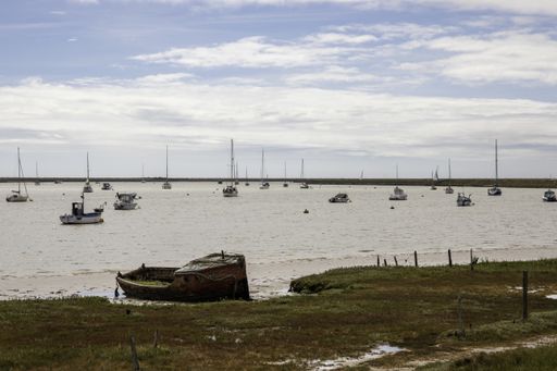 An abandoned boat on the River Ore in Orford, Suffolk.