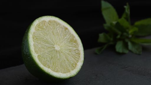 Green Lime with mint on a black background