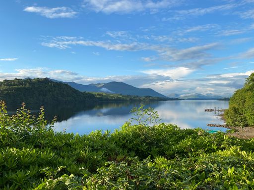 A beautiful shot of the mountains in Scotland against a blue cloudy sky