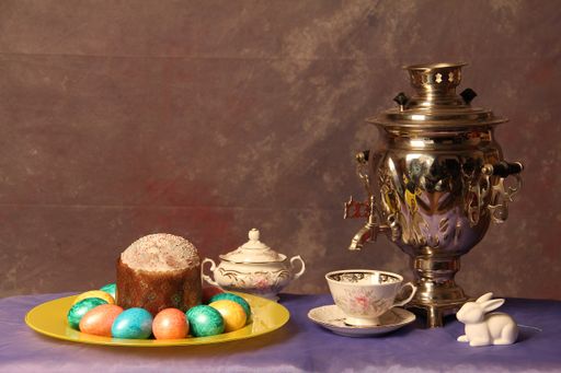 A still life shot of Easter composition against a brown background