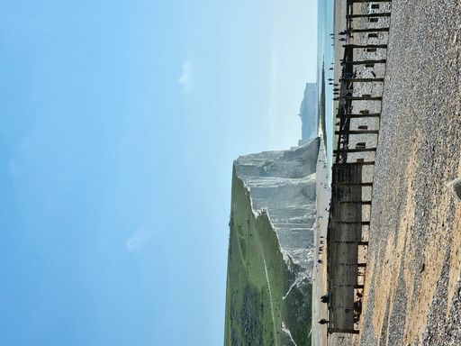 A vertical breathtaking view of Seven Sisters cliff at a distance in East Sussex, England