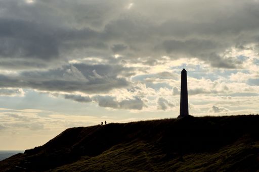 A beautiful shot of a lighthouse silhouette on a hill  in Northern France